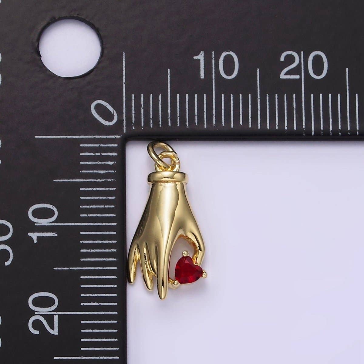 red gem hand charm