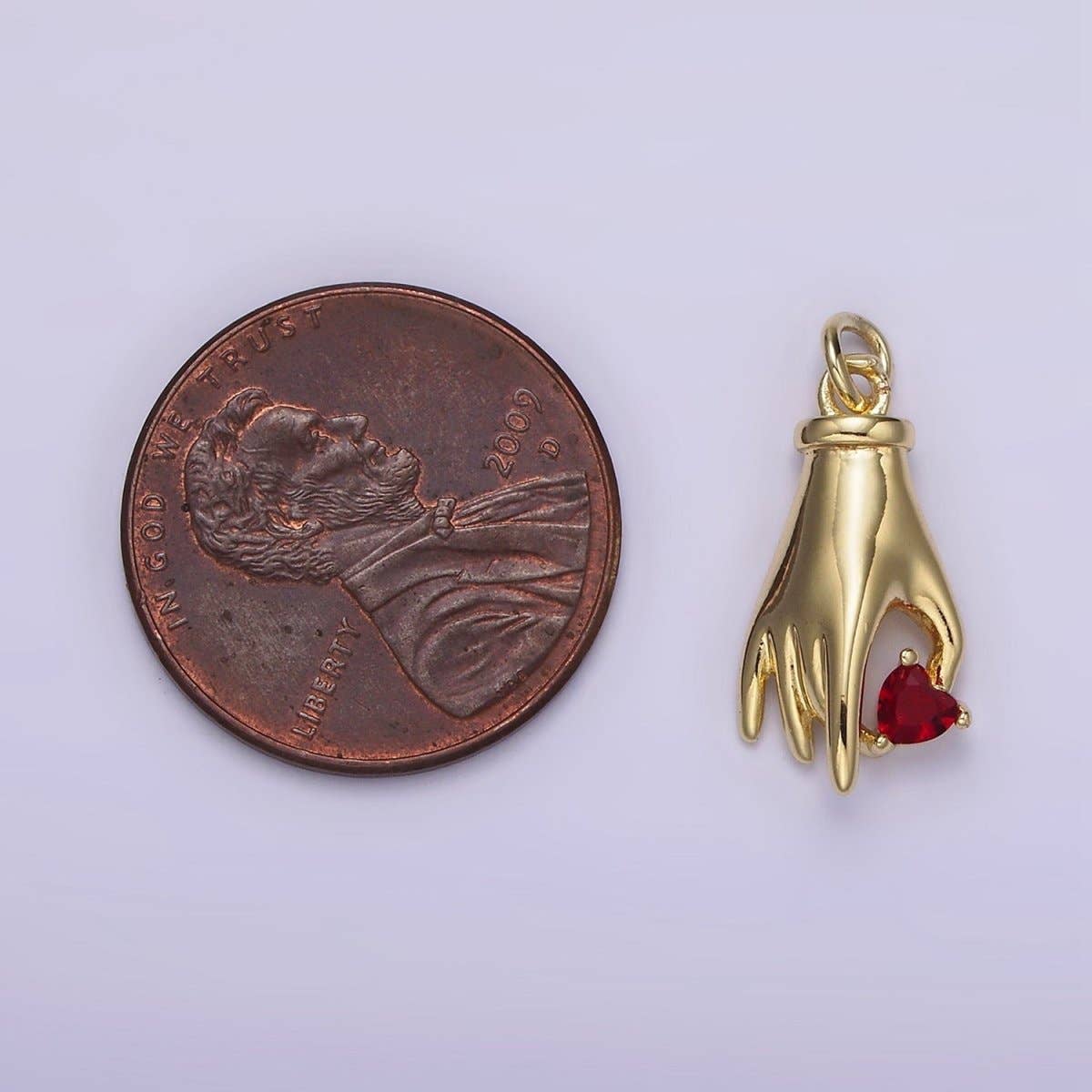 red gem hand charm